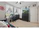 Bedroom with a sofa, fan, and a large television, creating a cozy and relaxing atmosphere at 720 Celebration Ave # 245, Kissimmee, FL 34747