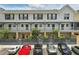 Townhouse style building in a parking lot with visible second story balconies at 720 Celebration Ave # 245, Kissimmee, FL 34747