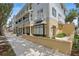 Attractive building with street level business and upper level apartments on a beautiful day at 720 Celebration Ave # 245, Kissimmee, FL 34747