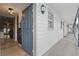 Inviting condo entryway featuring stylish light fixtures and an open door to the interior at 720 Celebration Ave # 245, Kissimmee, FL 34747