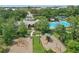 Community playground with play equipment, pool, and clubhouse for neighborhood enjoyment at 720 Celebration Ave # 245, Kissimmee, FL 34747