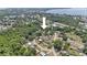 Aerial view of a residential area near a bay at 881 Cedar Cir, Tavares, FL 32778