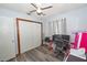 Bedroom with ceiling fan, desk area with computer, and closet for storage at 881 Cedar Cir, Tavares, FL 32778