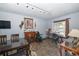 Comfortable dining room featuring wooden dining table, fireplace, and natural light at 881 Cedar Cir, Tavares, FL 32778