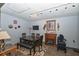 Inviting dining room with wooden dining table, fireplace, and natural light at 881 Cedar Cir, Tavares, FL 32778