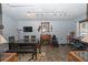 Spacious dining room area including wooden dining table, work space, and fireplace at 881 Cedar Cir, Tavares, FL 32778
