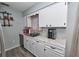Cozy kitchen area featuring updated counters and white cabinets at 881 Cedar Cir, Tavares, FL 32778