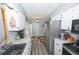 Charming kitchen with stainless appliances and adjacent breakfast nook at 881 Cedar Cir, Tavares, FL 32778
