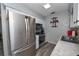 Modern kitchen with stainless steel appliances, white cabinets, and stylish flooring at 881 Cedar Cir, Tavares, FL 32778