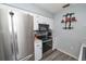 Cozy kitchen featuring stainless steel appliances and updated cabinetry at 881 Cedar Cir, Tavares, FL 32778