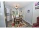 Dining area off the kitchen with a table and access to the backyard at 881 Cedar Cir, Tavares, FL 32778