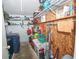 Cluttered storage room with washer/dryer, shelving, and ample space for organizing household items at 881 Cedar Cir, Tavares, FL 32778