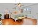 Comfortable bedroom with a ceiling fan, bright windows, and bedside tables with lamps at 888 Wakulla Ln, Winter Springs, FL 32708