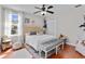 Cozy bedroom features wood floors, accent wall, and a window with lots of natural light at 888 Wakulla Ln, Winter Springs, FL 32708
