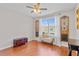 Bedroom featuring wood floors, a large window, and stylish decor at 888 Wakulla Ln, Winter Springs, FL 32708