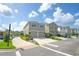 Street view of a two-story home with a double garage and lush, colorful landscaping at 888 Wakulla Ln, Winter Springs, FL 32708