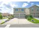 Two-story home featuring a double garage, a wide driveway, and manicured landscaping at 888 Wakulla Ln, Winter Springs, FL 32708