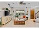 Stylish living room featuring a modern entertainment center, large windows, and comfortable seating at 888 Wakulla Ln, Winter Springs, FL 32708