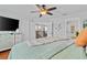 Spacious main bedroom showcasing a ceiling fan, walk-in closet, and ample natural light at 888 Wakulla Ln, Winter Springs, FL 32708