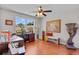 Bright home office with wood floors, large window, and stylish decor at 888 Wakulla Ln, Winter Springs, FL 32708