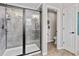 Modern shower featuring black trim, tiled walls, and glass enclosure at 888 Wakulla Ln, Winter Springs, FL 32708