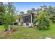 Secluded backyard featuring lush landscaping and a screened lanai at 942 Beach Breeze Dr, Orlando, FL 32835