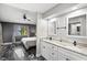 Elegant bathroom with double vanity, granite countertops, and lake view from bedroom window at 942 Beach Breeze Dr, Orlando, FL 32835