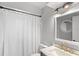 Beautiful bathroom with a marble countertop and a modern light fixture above the mirror at 942 Beach Breeze Dr, Orlando, FL 32835