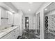 Hallway featuring a marble floor and sliding doors to the bathroom and closet at 942 Beach Breeze Dr, Orlando, FL 32835