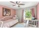 Charming bedroom featuring soft pink walls, and water view at 942 Beach Breeze Dr, Orlando, FL 32835