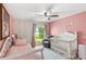 Charming bedroom featuring soft pink walls, and water view at 942 Beach Breeze Dr, Orlando, FL 32835