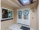Inviting double door entryway with decorative wreaths and skylight, creating a warm welcome at 942 Beach Breeze Dr, Orlando, FL 32835