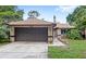 Charming single-story home with a two-car garage, well-maintained lawn, and inviting curb appeal at 942 Beach Breeze Dr, Orlando, FL 32835