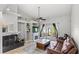 Bright living room features high ceilings, a fireplace, and glass doors to the outside at 942 Beach Breeze Dr, Orlando, FL 32835