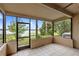 Screened patio offering serene views of the lake at 942 Beach Breeze Dr, Orlando, FL 32835