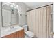 Bright bathroom with sink vanity, toilet, and shower-tub combination at 1028 Ocala Woods Ln, Orlando, FL 32824