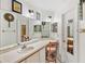 Bathroom featuring countertop, mirror, and neutral finishes at 1028 Ocala Woods Ln, Orlando, FL 32824