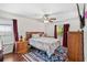 Bedroom featuring hardwood floors, ceiling fan and natural light at 1028 Ocala Woods Ln, Orlando, FL 32824