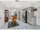 Bright dining area adjoining kitchen, complete with stainless steel appliances and stylish tile flooring at 1028 Ocala Woods Ln, Orlando, FL 32824