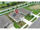 Aerial view of a residential home with a red icon on the roof, showcasing the neighborhood layout at 1061 Citrus Landings Blvd, Davenport, FL 33837