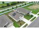 Aerial view of a residential home showcasing neighborhood layout, street access, and nearby community features at 1061 Citrus Landings Blvd, Davenport, FL 33837