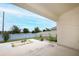 Covered back patio overlooking a spacious yard with a fire pit area at 1061 Citrus Landings Blvd, Davenport, FL 33837
