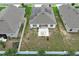 Aerial of the backyard featuring a fire pit, fence, and a patio area of the home at 1061 Citrus Landings Blvd, Davenport, FL 33837