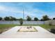 Spacious backyard featuring concrete patio and fire pit, perfect for outdoor entertaining at 1061 Citrus Landings Blvd, Davenport, FL 33837