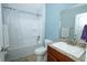 Clean bathroom with shower and tub combination and granite countertop vanity at 1061 Citrus Landings Blvd, Davenport, FL 33837
