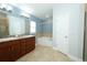 Bathroom featuring double vanity, soaking tub, and tiled backsplash at 1061 Citrus Landings Blvd, Davenport, FL 33837