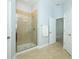 Walk in shower with glass enclosure and tiled walls at 1061 Citrus Landings Blvd, Davenport, FL 33837