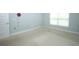 Large bedroom with neutral carpet, window, and base molding at 1061 Citrus Landings Blvd, Davenport, FL 33837