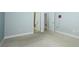 Spacious bedroom featuring neutral carpet, base molding, and ensuite bathroom access at 1061 Citrus Landings Blvd, Davenport, FL 33837