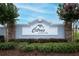 Citrus Landing community entrance sign surrounded by lush greenery and flowering trees at 1061 Citrus Landings Blvd, Davenport, FL 33837